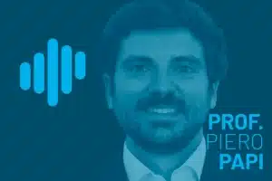 Portrait of Prof. Piero Papi in a blue-toned podcast visual with a left-side waveform logo, presenting a clean professional look with a subtle facial beard